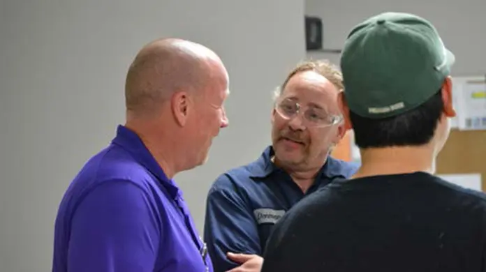 East Jordan Plastics coworkers chatting.